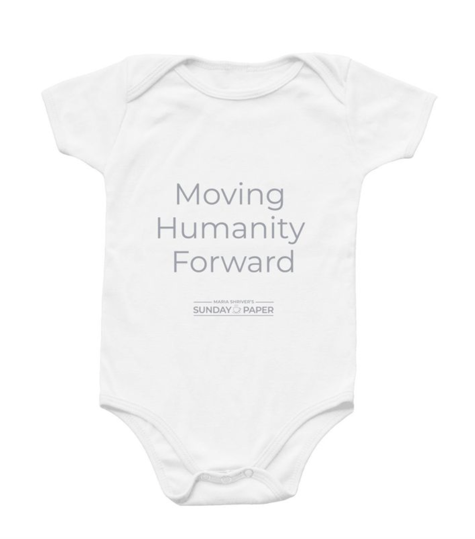 A baby onesie with the logo - moving humanity forward in white