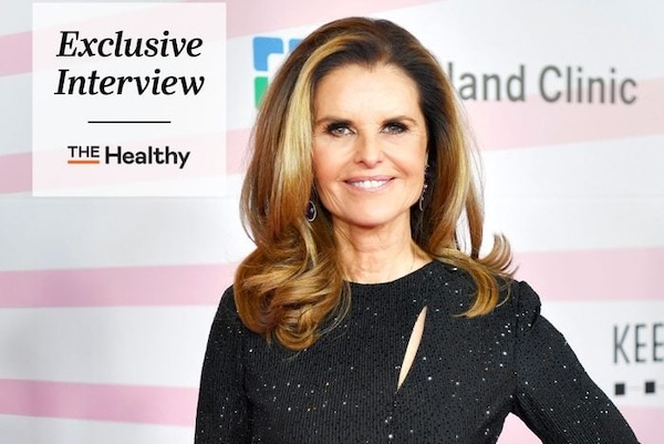 Maria Shriver in a black sparkly dress at an event with 